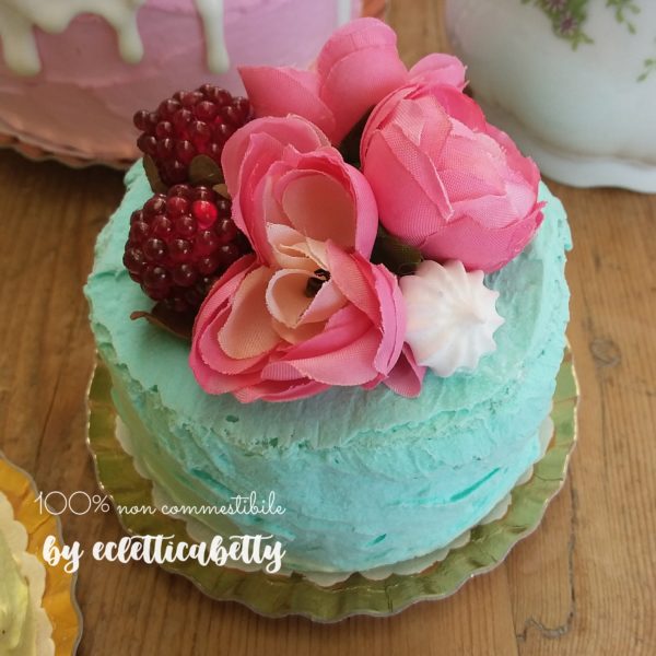Petit Bijou verde pastello con fiori e frutti